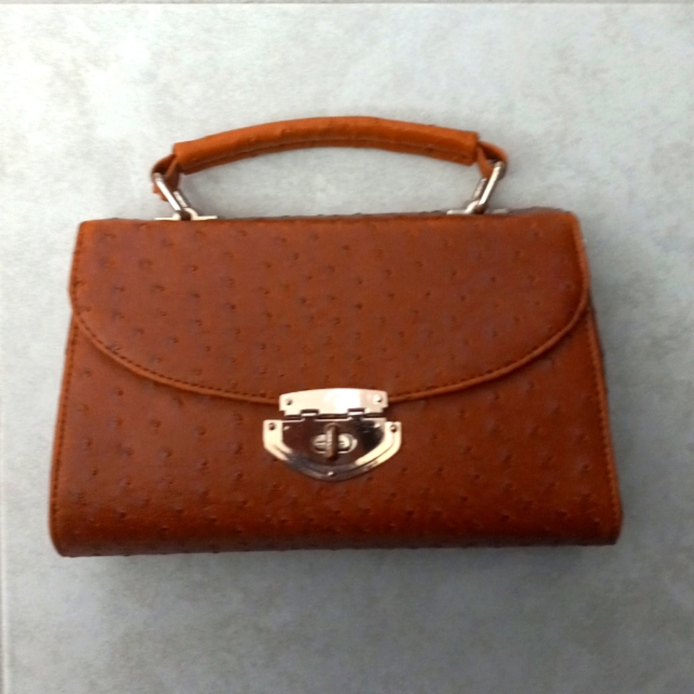 ~ Chic orangish brown purse ~ Dimensions are 11 by 8 ~